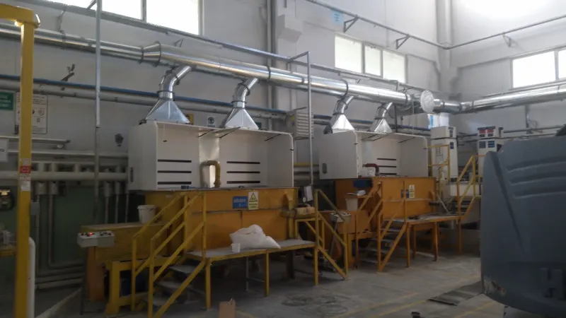 Extraction hoods over production cabinets