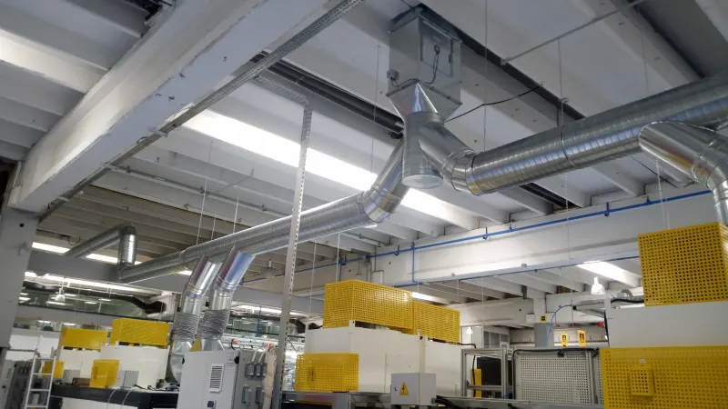 Spiral duct extraction system over a production line
