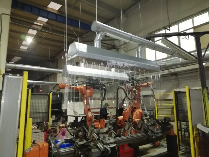 Fume extraction hood over a robotic welding cell