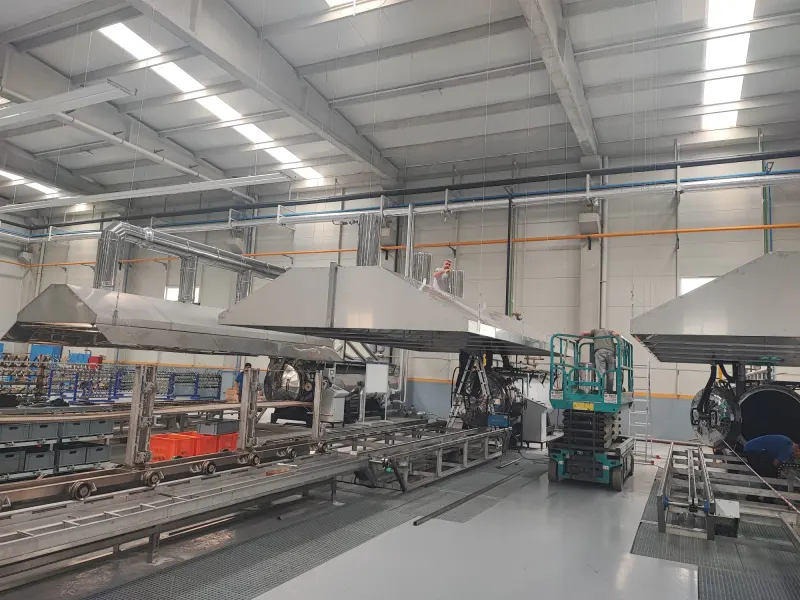 Steam extraction hoods over an autoclave line